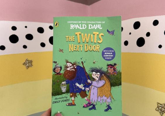 picture of The Twits Next door childrens book in front of a rainbow wall