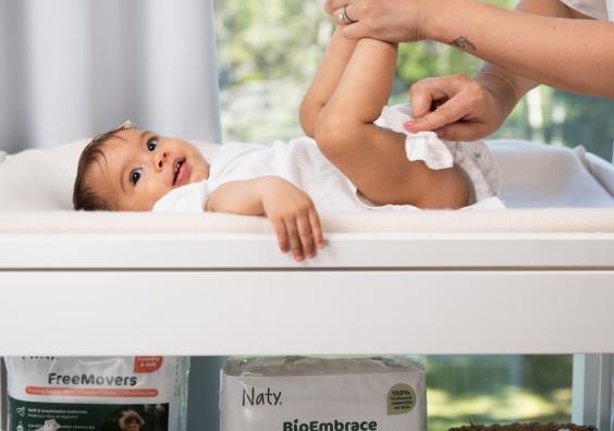 a baby having their nappy changed with naty baby wipes picture of a baby having their nappy changed with naty baby wipes