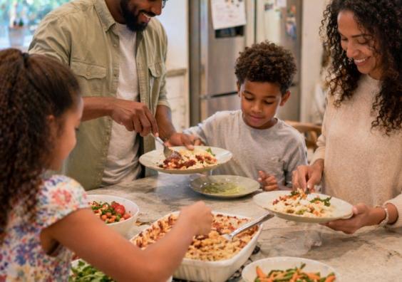 picture of Family eating together at home showing the importance of shared mealtimes and family