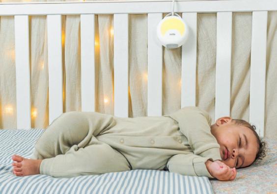 a baby sleeping in a cot with Soothing sounds from Zelo white noise machine picture of a baby sleeping in a cot with Soothing sounds from Zelo white noise machine