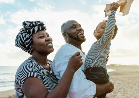picture of a happy African family on a beach