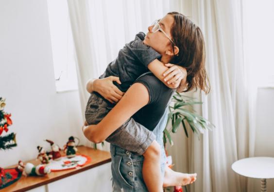 picture of a mum hugging her child helping them to manage their emotions