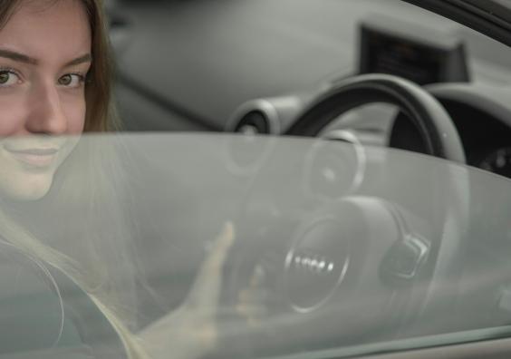 teenager driving a car