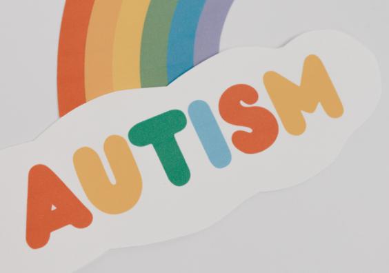 picture of the word autism with a rainbow coming out of it