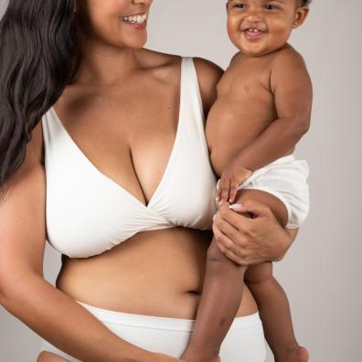 picture of a mum holding a baby wearing a bralette