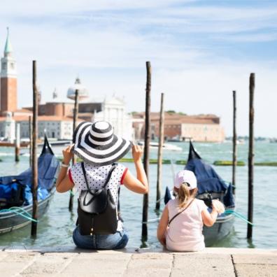 picture of mother and daughter looking out at a harbour
