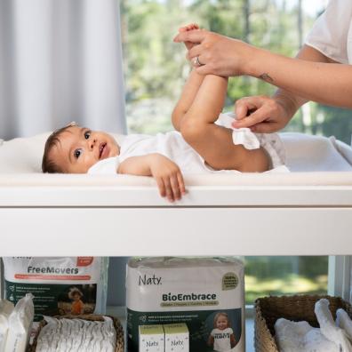 picture of a baby having their nappy changed with naty baby wipes