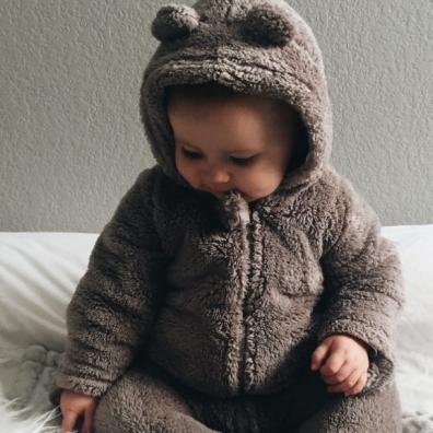 Baby in cute teddy outfit