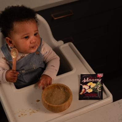 picture of a Baby weaning with Bloom food pouches