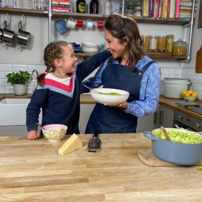 Picture of Dr Sarah Ockwell smith teaching a child how to cook