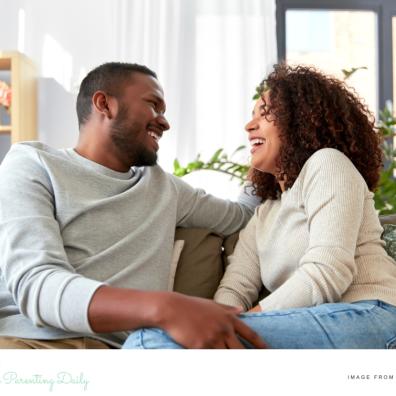 picture of a happy couple looking at eachother laughing