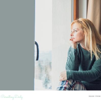 a woman looking out of a window picture of a woman looking out of a window