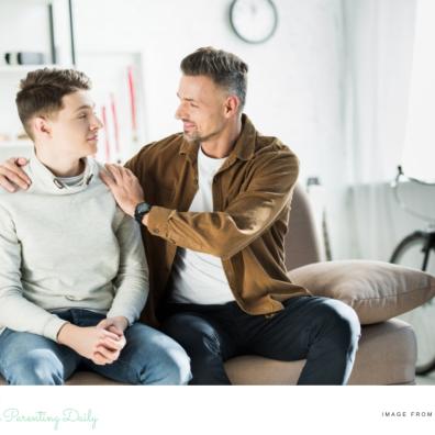 picture of a dad with his arms around his teenage son supporting him through mental health