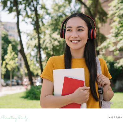 picture of a happy university student who is learning how to budget