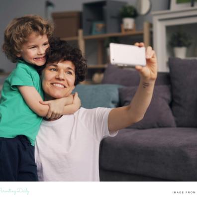picture of a mum taking a selfie photograph of her and her son on her smartphone