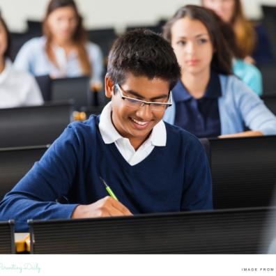 happy children sat in a classroom at a private school picture of happy children sat in a classroom at a private school