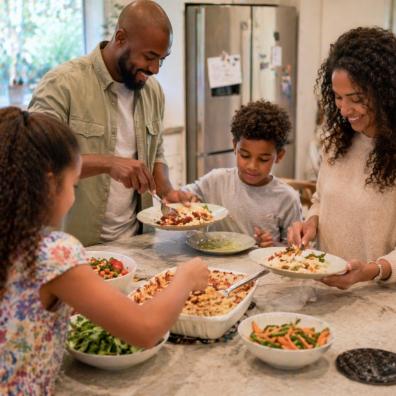 picture of Family eating together at home showing the importance of shared mealtimes and family