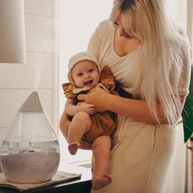 picture of mum and happy baby with crane humidifier