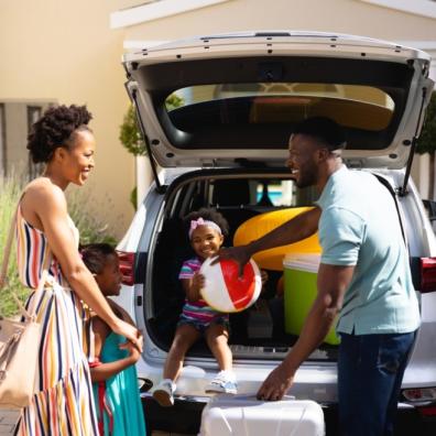 picture of a Family packing a car to go away