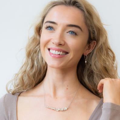 picture of a woman wearing a foxglove sterling silver necklace 