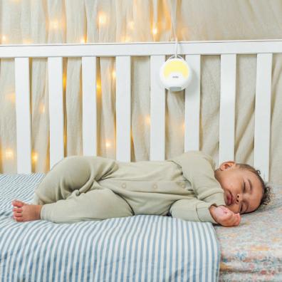 picture of a baby sleeping in a cot with Soothing sounds from Zelo white noise machine