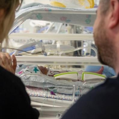 Mum and dad with baby in neonatal unit