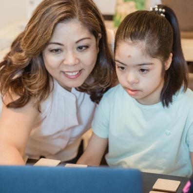 picture of a mother and daughter home learning