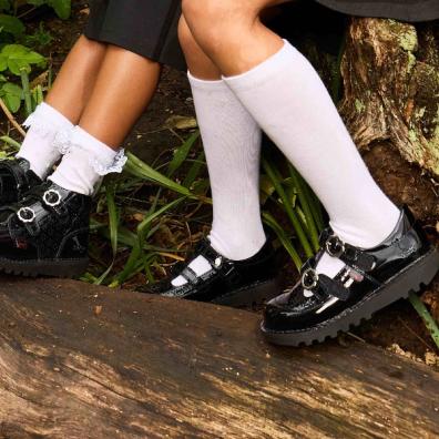 picture of girls wearing white school socks and kickers school shoes