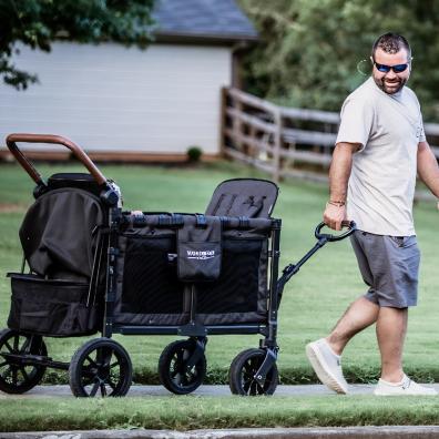 picture of a dad pulling a Wonderfold Wagon