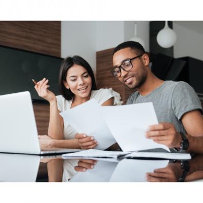 Picture of a happy young couple looking at their finances