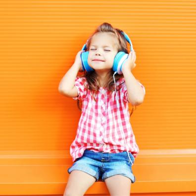 Picture of a happy child listening to headphones
