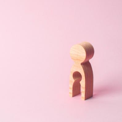 Picture of a wooden figure with a baby shaped gap in