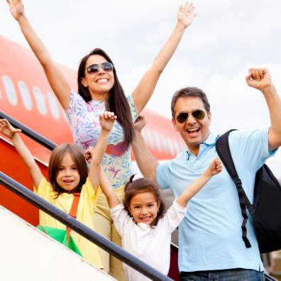 Picture of excited family getting on a aeroplane to go on holiday