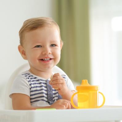 picture of a happy baby in a highchair