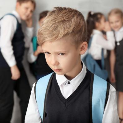 picture of a young boy being bullied at school