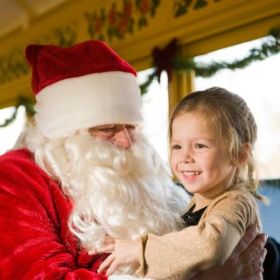 picture of a little girl on a santa express train