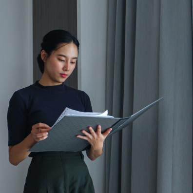 picture of a woman holding a case file