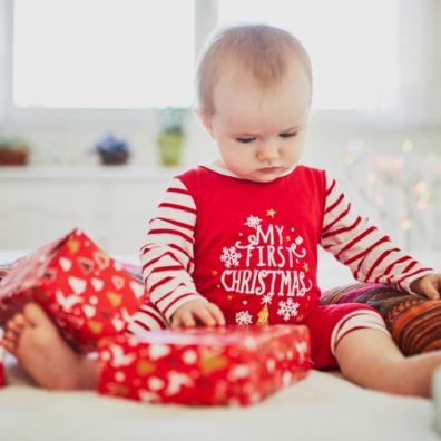 picture of a baby at christmas wearing a my first christmas outfit