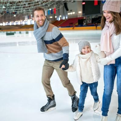 picture of a happy family at an ice skating rink