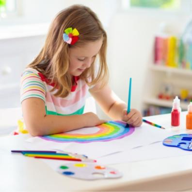 picture of a happy child doing craft