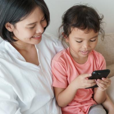 picture of a happy mum and her child using a smartphone