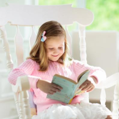 picture of a happy child reading a book