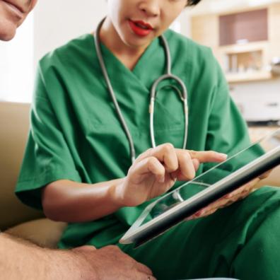 picture of health professional showing patient an app