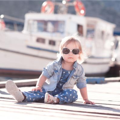 picture of trendy baby on a dock