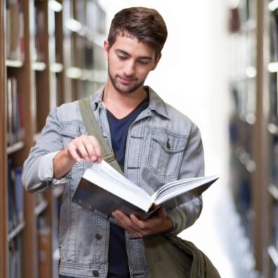 Picture of a male student in a library