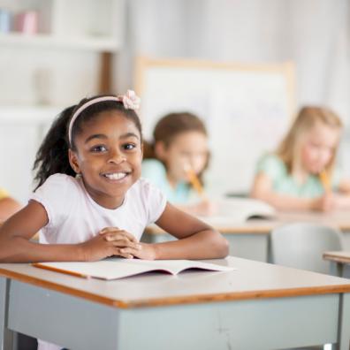 picture of a happy school child in a classroom