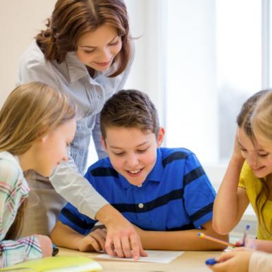 picture of school children in class with a teacher
