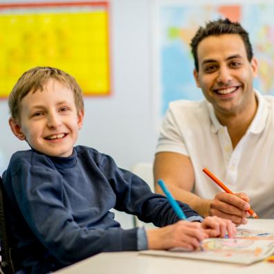 picture of a child with special educational needs and his teacher