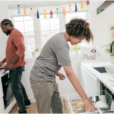 picture of a couple cleaning the kitchen