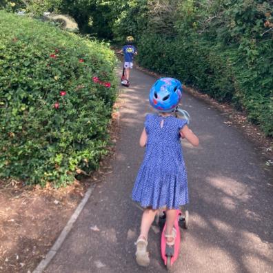 picture of children riding scooters